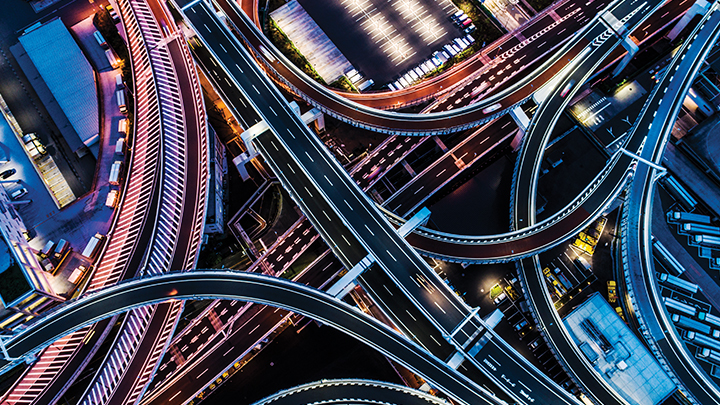 Aerial view of highway interchange at night