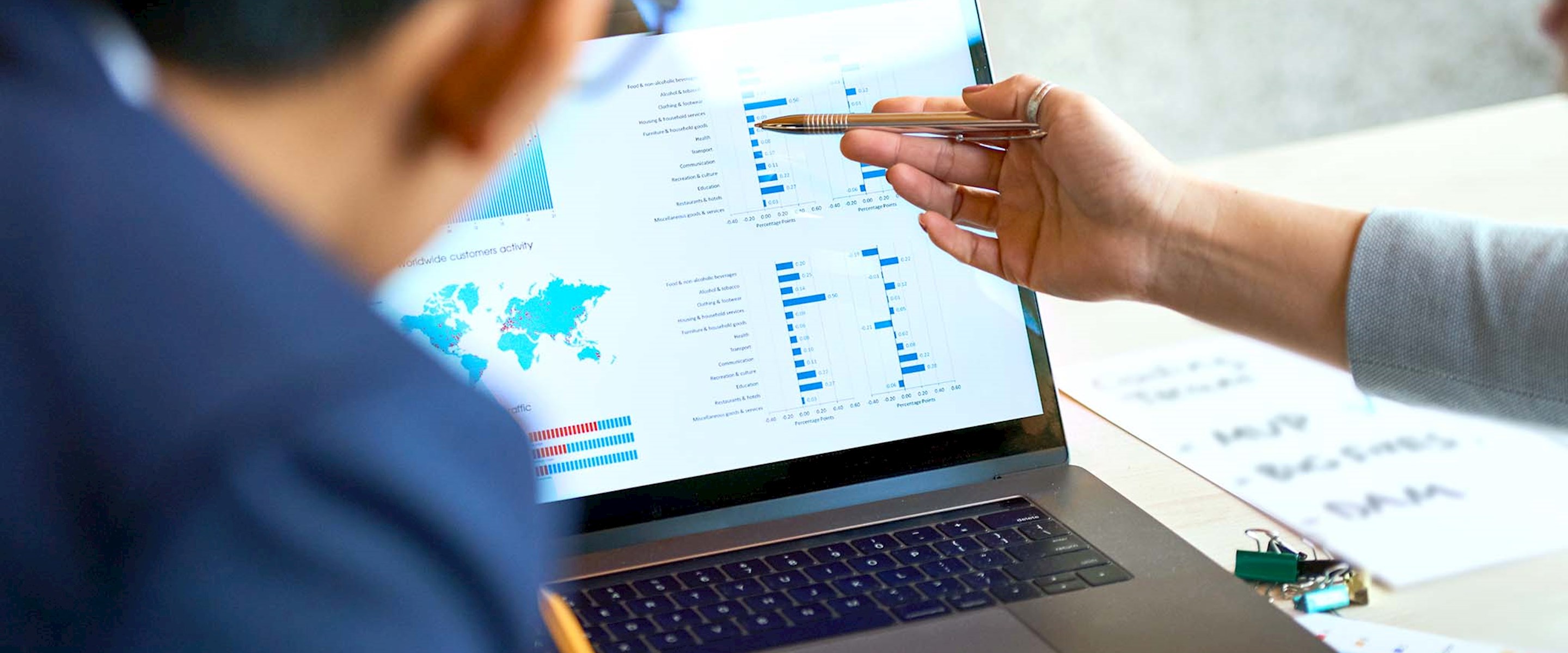 Close up of people looking at a laptop