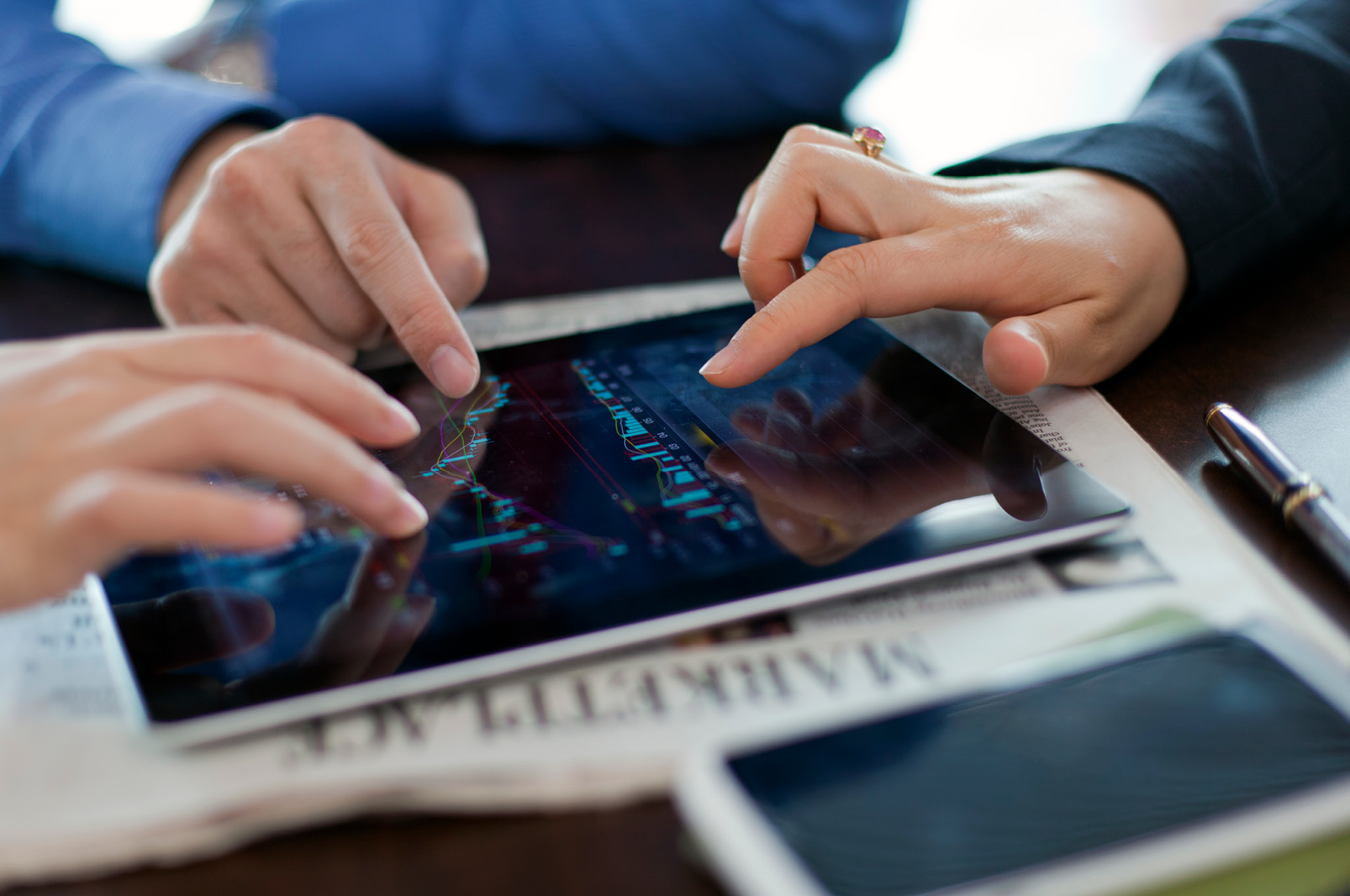 Hands on a tablet