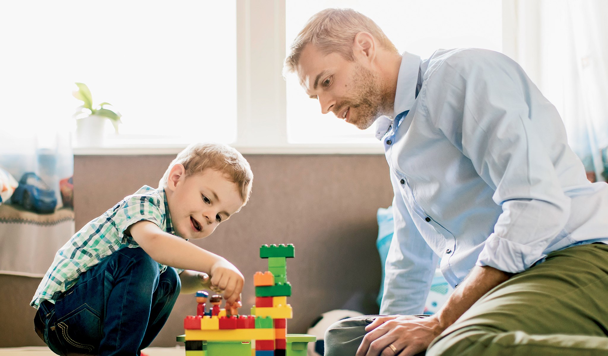 Dad and son playing on the floor